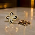 Black and Gold Floral Earrings Elegant Four-Petal Studs with Black Enamel, Cubic Zirconia & Super Gold-Tone A1 Detailing - Image 2