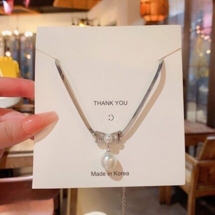 Elegant Korean Knot Shape Pearl Pendant super Stylish Alloy Necklace with Classic Pearl Design in 2 colours Silver & Golden